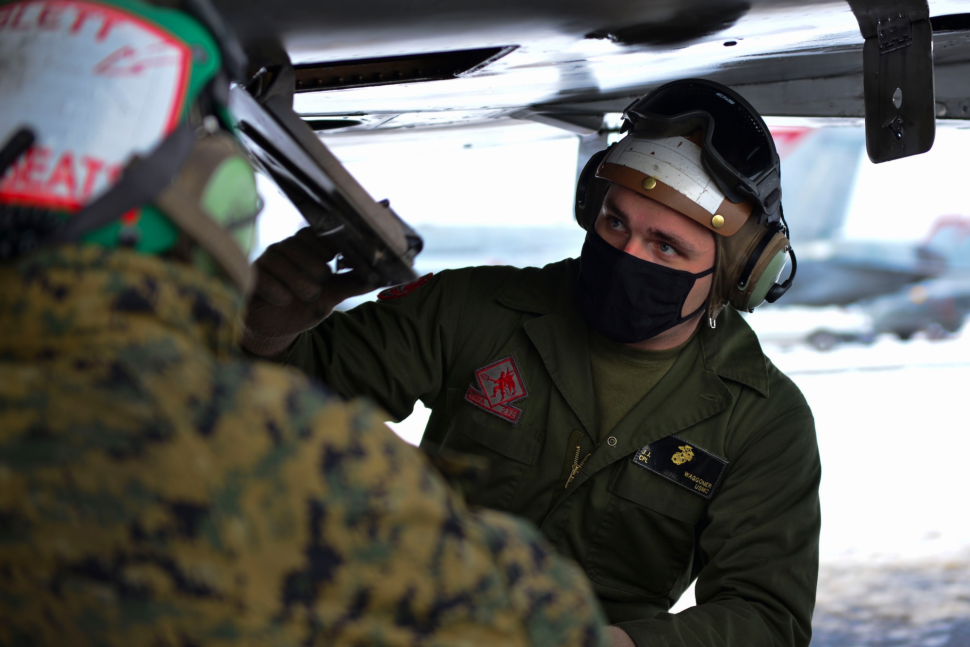 U.S. Marine Corps Cpl. Jeremy Waggoner, Jr., a Marine Fighter Attack Squadron (VMFA) 232 plane captain, conducts pre-flight checks during RED FLAG-Alaska 21-1 at Eielson Air Force Base, Alaska, Oct. 20, 2020.
