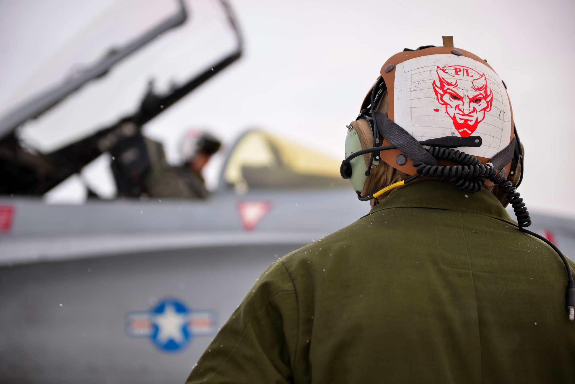 U.S. Marine Corps Cpl. Jeremy Waggoner, Jr., a Marine Fighter Attack Squadron (VMFA) 232 plane captain, stands by as a pilot prepares to taxi during RED FLAG-Alaska (RF-A) 21-1 at Eielson Air Force Base, Alaska, Oct 20, 2020.