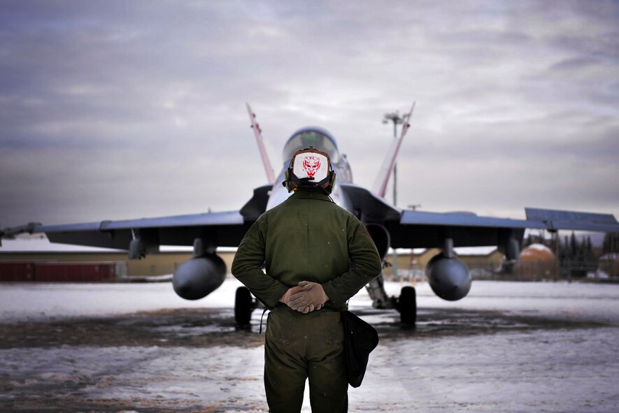 U.S. Marine Corps Cpl. Jeremy Waggoner, Jr., a Marine Fighter Attack Squadron (VMFA) 232 plane captain, stands by as a pilot prepares to taxi during RED FLAG-Alaska 21-1 at Eielson Air Force Base, Alaska, Oct 20, 2020.