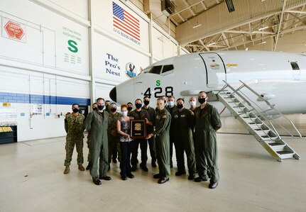 Rear Admiral Lance Scott, Commander, Patrol and Reconnaissance Group (CPRG), presents Patrol Squadron Thirty’s (VP-30) Safety Team with the CNO Aviation Safety Award in VP-30’s hangar on NAS Jacksonville October 15, 2020.