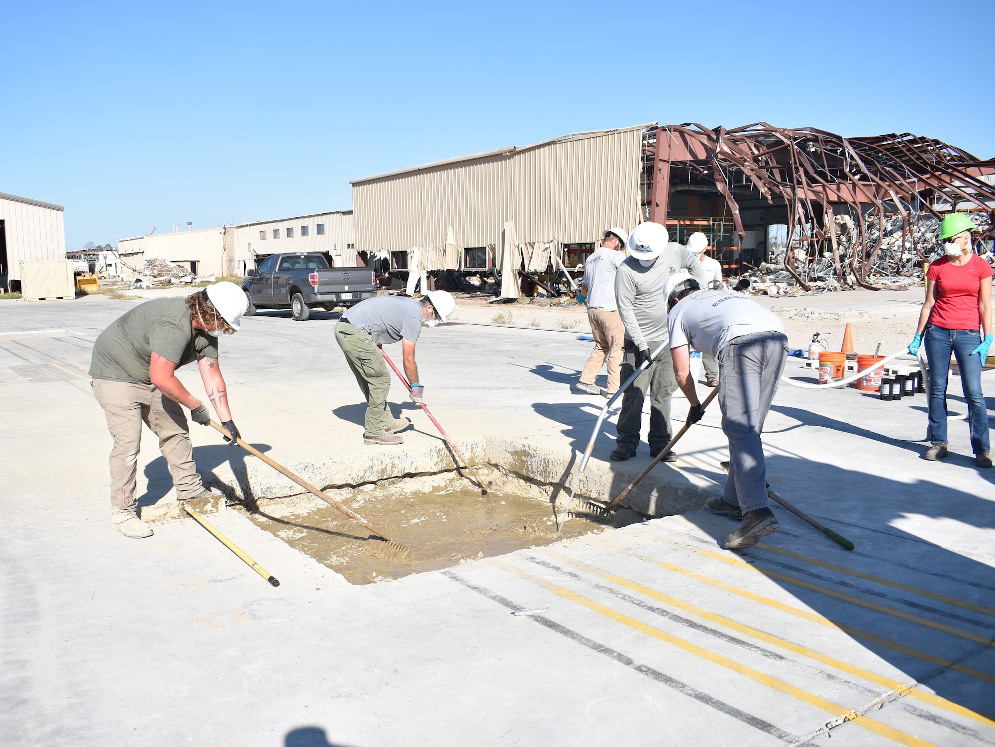 The Air Force Civil Engineer Center Lab research team perform the dry placement of K-Fill CLSM