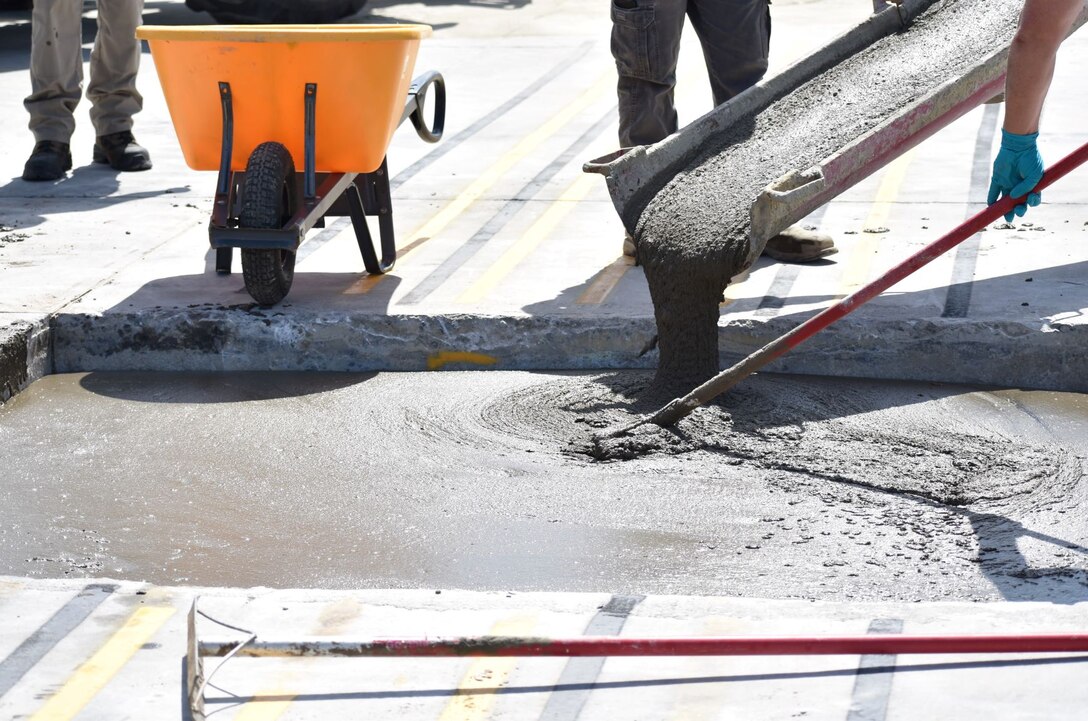 The research team place K-Fill Controlled Low-Strength Material into a crater using a 10.5 cubic yard concrete truck in July 2019