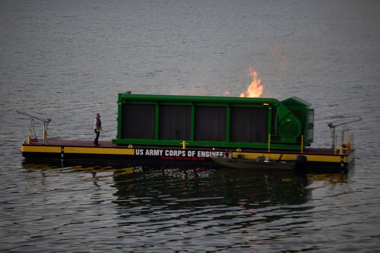 A new floating barge and air curtain burner incinerates debris early morning Oct. 21, 2020 on Lake Cumberland near Waitsboro Recreation Area in Somerset, Kentucky. (USACE Photo by Lee Roberts)
