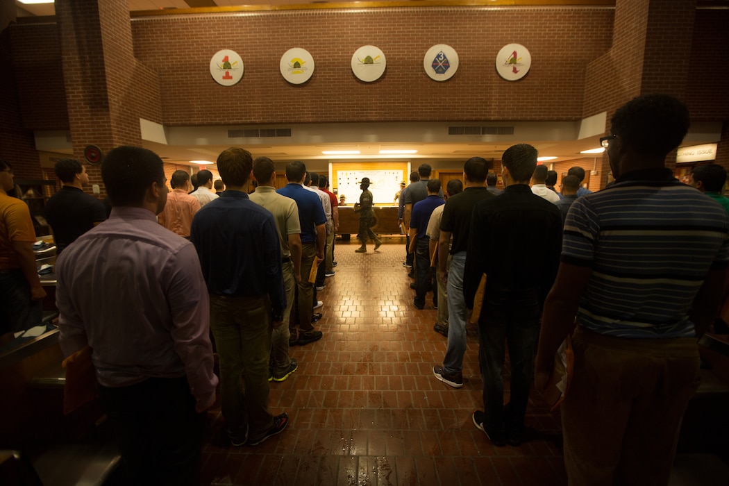 A drill instructor with Recruit Processing Company, Support Battalion, gives new recruits of Echo Company, 2nd Recruit Training Battalion, one of their first orders on Parris Island, S.C., May 22, 2017. Recruits must go through processing to ensure they have the necessary uniforms and equipment to begin training. Echo Company is scheduled to graduate Aug. 18, 2017. Parris Island has been the site of Marine Corps recruit training since Nov. 1, 1915. Today, approximately 19,000 recruits come to Parris Island annually for the chance to become United States Marines by enduring 12 weeks of rigorous, transformative training. Parris Island is home to entry-level enlisted training for approximately 49 perceA U.S. Marine Corps drill instructor with Recruit Processing Company, Support Battalion, gives new recruits of Echo Company, 2nd Recruit Training Battalion, one of their first orders on Parris Island, S.C., May 22, 2017. Recruits must go through processing to ensure they have the necessary uniforms and equipment to begin training. Echo Company is scheduled to graduate Aug. 18, 2017. Parris Island has been the site of Marine Corps recruit training since Nov. 1, 1915. Today, approximately 19,000 recruits come to Parris Island annually for the chance to become United States Marines by enduring 12 weeks of rigorous, transformative training. Parris Island is home to entry-level enlisted training for approximately 49 percent of male recruits and 100 percent of female recruits in the Marine Corps. (U.S. Marine Corps photo by Lance Cpl. Carlin Warren)nt of male recruits and 100 percent of female recruits in the Marine Corps. (Photo by Lance Cpl. Carlin Warren)