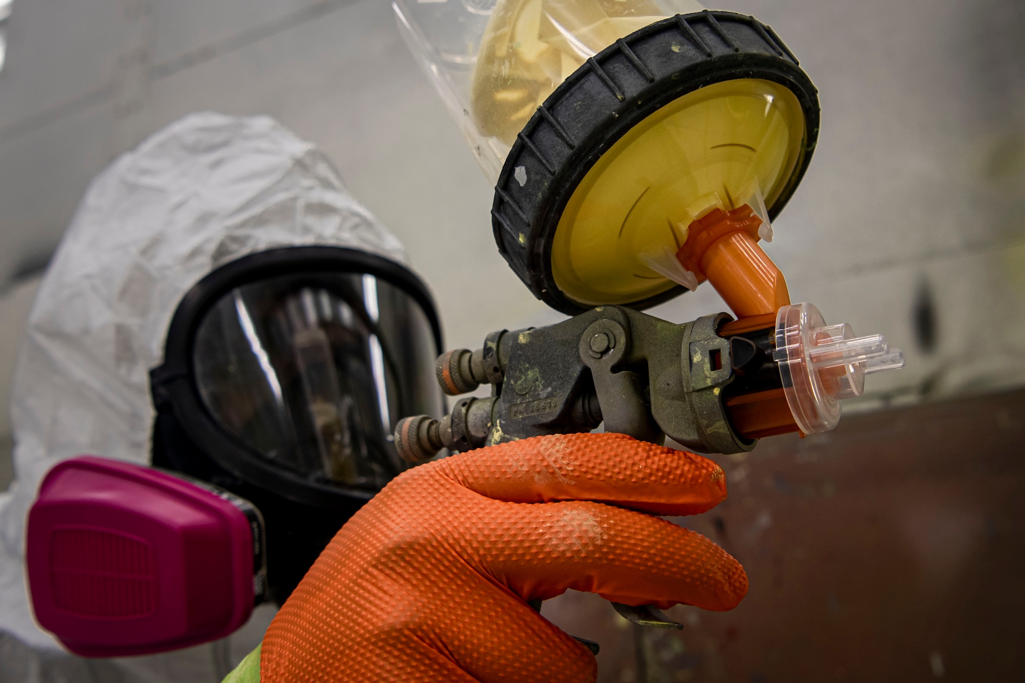 Photo of an Airman priming KC-10 Extender tubing.