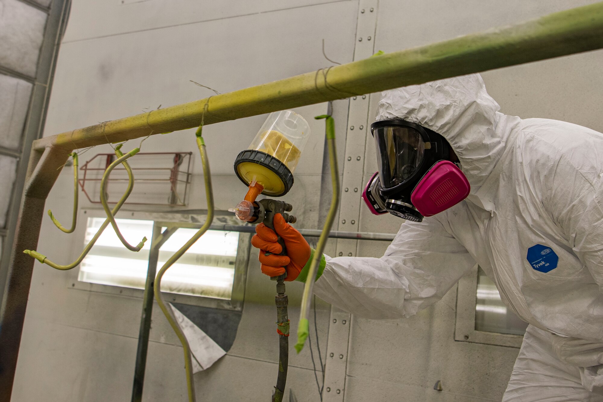Photo of an Airman priming KC-10 Extender tubing.