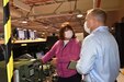 Photo of Cheryl Bachart discussing her work processes with team auditor Dan Wyrick