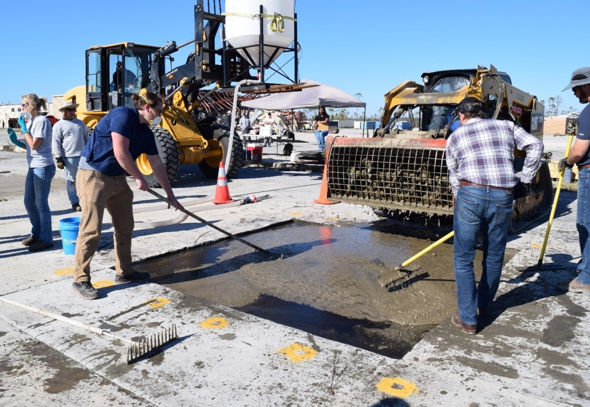 The Air Force Civil Engineer Center’s Readiness Directorate research team fills craters using K-Concrete.