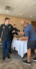 Soldiers help a Soldier before his board apperance