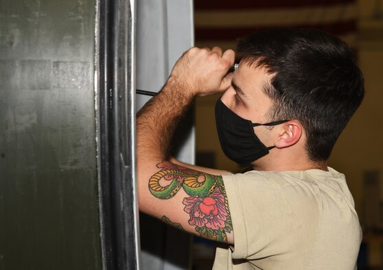A maintainer fixes an engine.