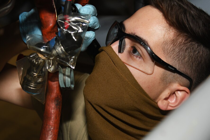 A maintainer fixes an engine.