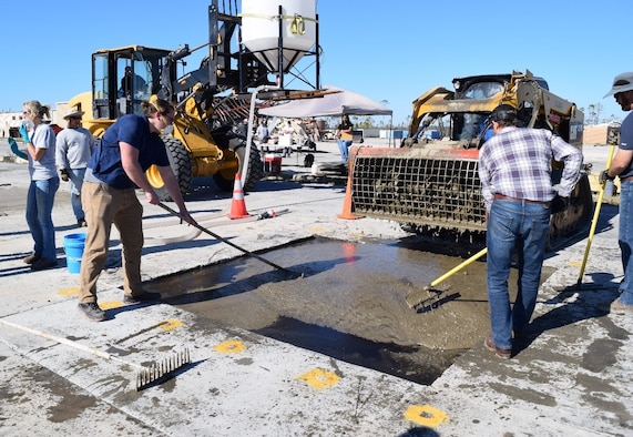 The Air Force Civil Engineer Center’s Readiness Directorate research team fills craters using K-Concrete.