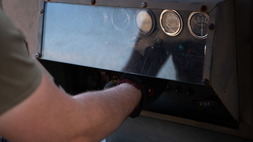 A crew chief from the 96th Aircraft Maintenance Unit operates machinery during Global Thunder 21 at Barksdale Air Force Base, La., Oct. 22, 2020.