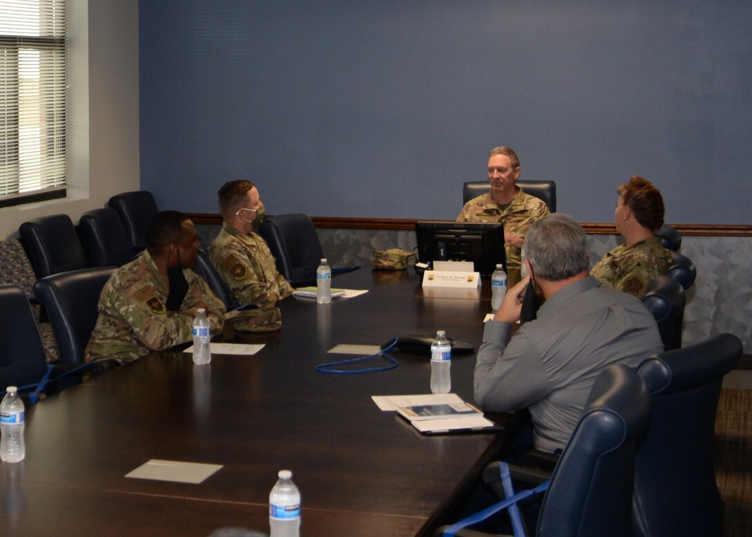 Col. Terry W. McClain, 433rd Airlift Wing commander (center), and Chief Master Sgt. Shana C. Cullum, 433rd AW command chief, meet with Col. Steven A. Strain 502nd Installation Support Group commander, Chief Master Sgt. Carey S. Jordan, 502nd ISG command chief, and Mark J. Tharp, 502nd ISG technical director, before a tour of the wing on Oct. 21, 2020 at Joint Base San Antonio-Lackland, Texas. (U.S. Air Force photo by Kristian Carter)