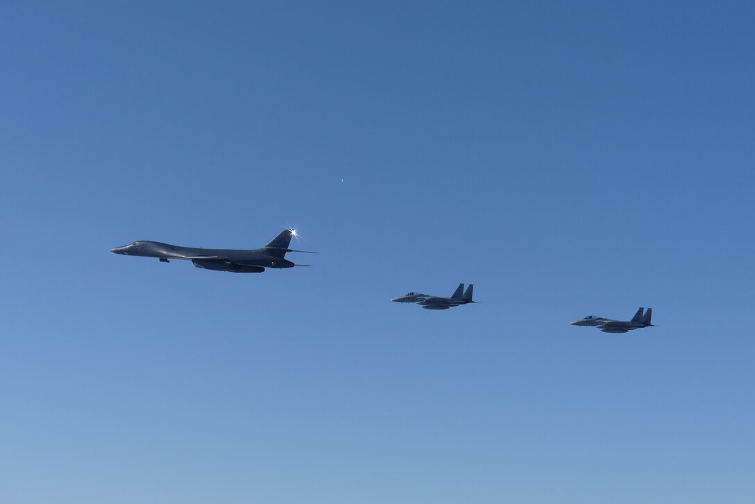 A B-1B Lancer, assigned to the 9th Expeditionary Bomb Squadron, Dyess Air Force Base, Texas, conducts training with two Koku-Jieitai (Japan Air Self Defense Force) F-15J fighters in the vicinity of the Sea of Japan, October 20, 2020.