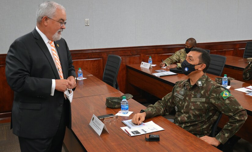 J.M. Harmon III provides Maj. Gen. Miranda Filho a briefing on the MEDCoE and future education and training opportunities between the two countries.