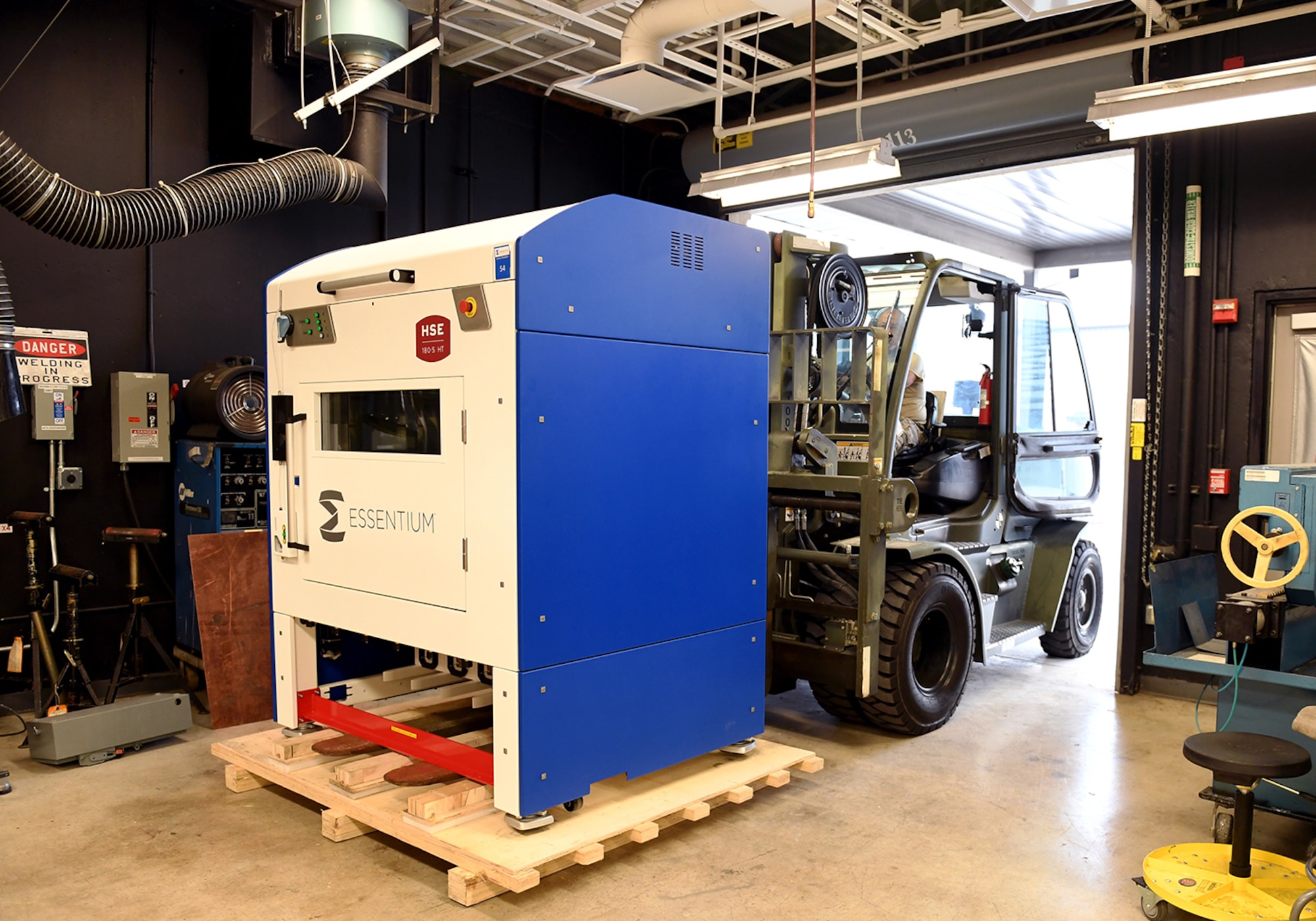 Texas National Guard Master Sgt. Carlos Gil, 149th Maintenance Squadron aircraft metals technician, uses a forklift to move a newly delivered 3D printer Aug. 12, 2020, at Joint Base San Antonio-Lackland, Texas.