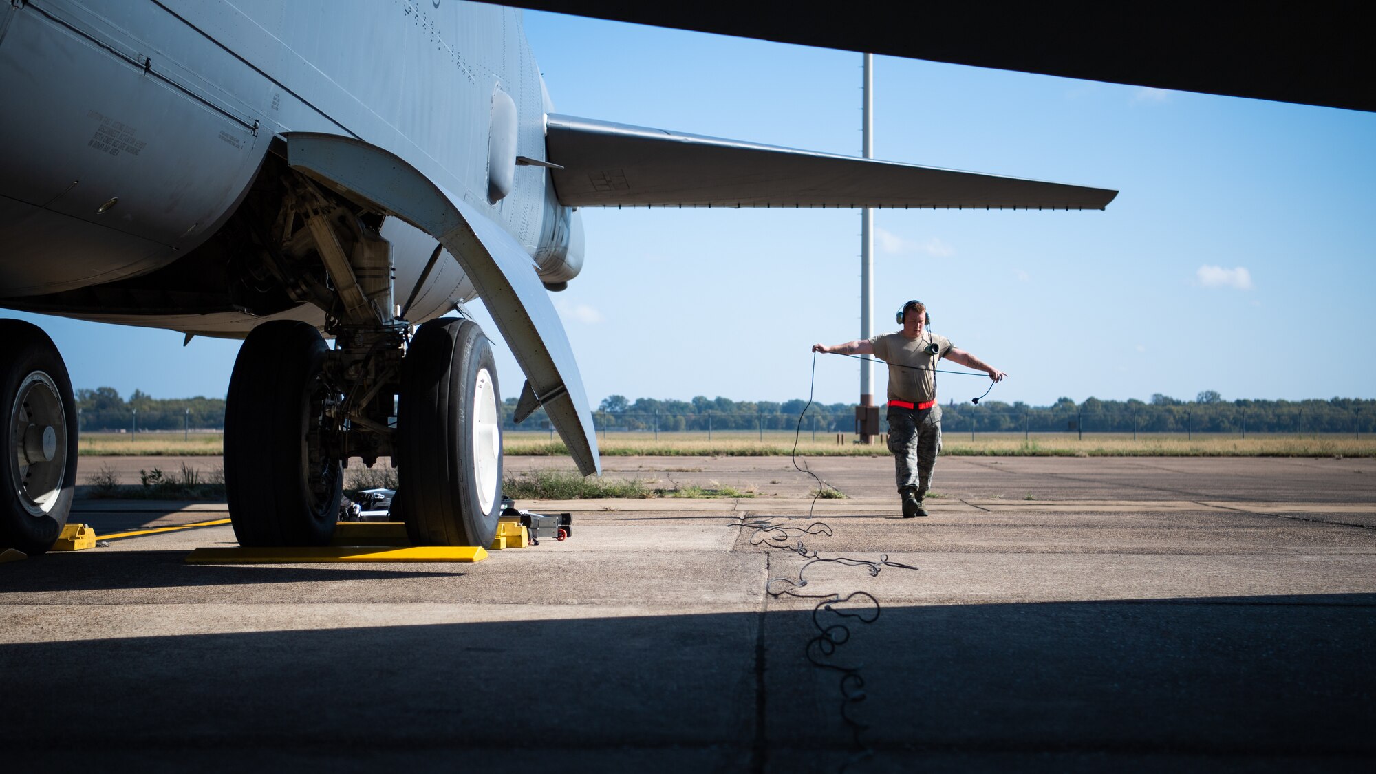 Senior Airman Jordan Wyatt, 2nd Aircraft Maintenance Unit crew chief, untangles a chord during Global Thunder 21 at Barksdale Air Force Base, La., Oct. 22, 2020.