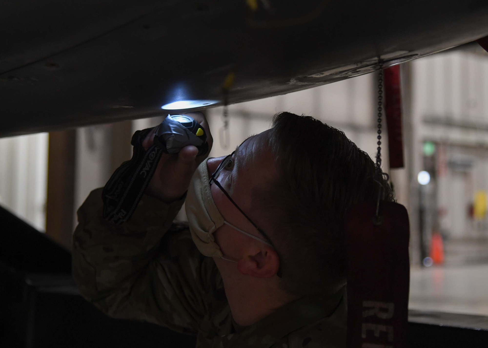 SSgt. William Patrick is a weapons specialist team chief for the 5th Aircraft Maintenance Squadron at Minot Air Force Base, on Oct. 21, 2020. Patrick and the three Airmen that he oversees have spent eight hours loading a full aircraft during the Prairie Vigilance exercise. As a team chief, he is his team’s source for information. They will come to him for questions or guidance on anything pertaining to their weapons systems (U.S. Air Force photo by Airman 1st Class Caleb S. Kimmell)