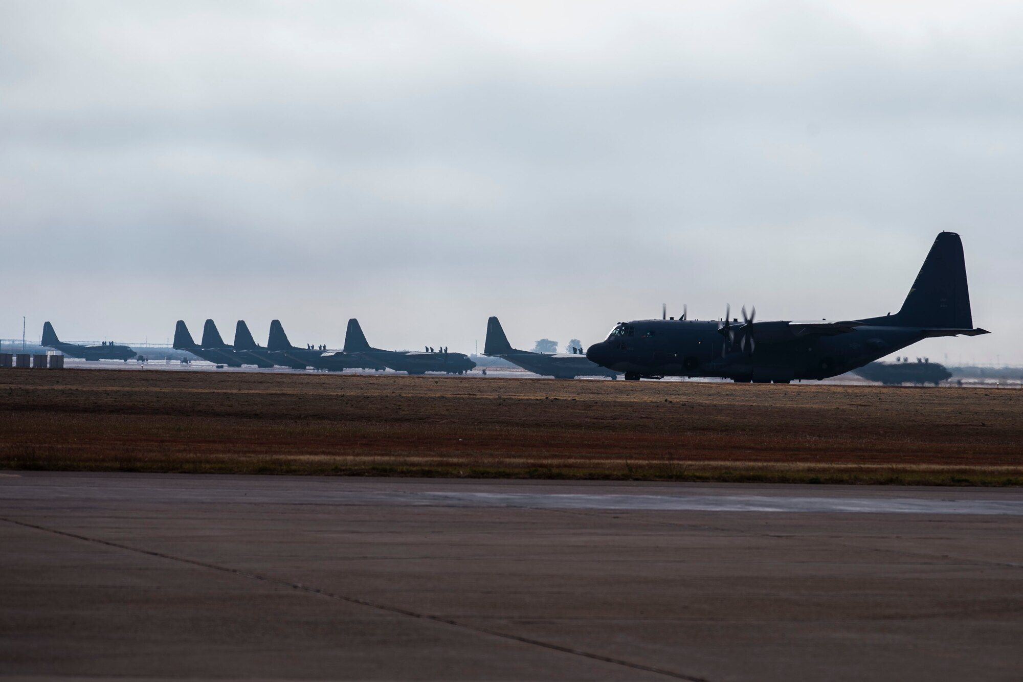 An AC-130W Stinger II gunship, Tail No. 1303, right, taxis the runway at Cannon Air Force Base, N.M., before its final flight prior to retirement Oct. 19, 2020. The Air Force received the aircraft from the Lockheed-Martin factory June 6, 1989, with the original nickname of ‘City of Hurricane.’ (U.S. Air Force photo by Staff Sgt. Luke Kitterman)