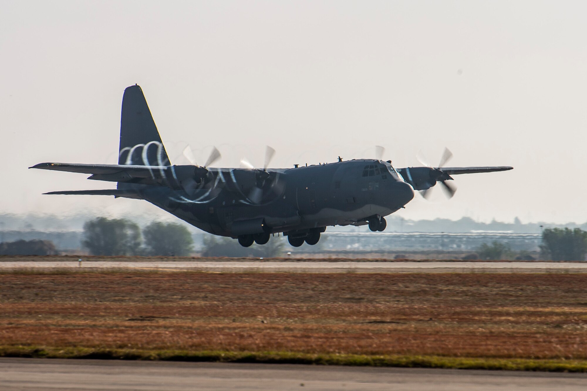 An AC-130W Stinger II gunship, Tail No. 1303, takes off on the runway at Cannon Air Force Base, N.M., for its final flight prior to retirement Oct. 19, 2020. As a gunship, Tail No. 1303 made its claim to fame by being the first gunship to record a combat kill on Feb. 9, 2011. It then went on to achieve another milestone by having the distinction of being the first 105mm cannon-installed whiskey to confirm a 105mm kill in December of 2016. (U.S. Air Force photo by Staff Sgt. Luke Kitterman)