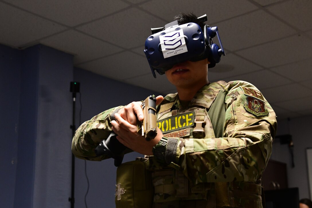 Staff Sgt. David Greenwood, 926th Security Forces Squadron training instructor, uses virtual reality to run through Use of Force training scenarios during the Mandatory Unit Training Assembly, Oct. 4, at Nellis Air Force Base, Nevada. (U.S. Air Force Photo by Senior Airman Brett Clashman)