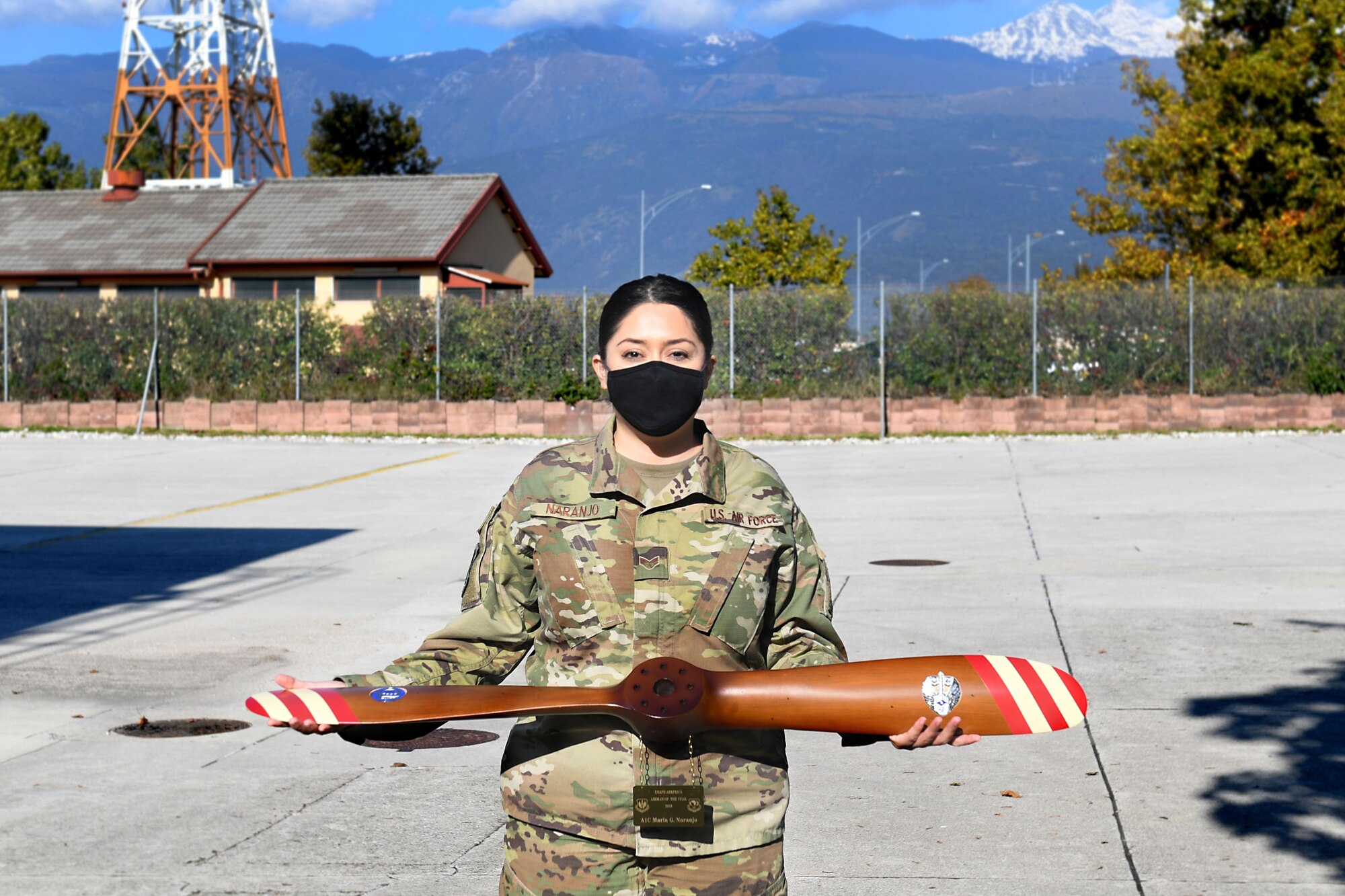 Senior Airman Maria Naranjo, 606th Air Control Squadron cyber transport systems technician, poses with her award for the 2019 U.S. Air Forces in Europe and Air Forces Africa Airman of the Year at Aviano Air Base, Italy, Oct. 14, 2020. During her time at Aviano, Naranjo has been selected for early promotion to senior airman below-the-zone and achieved her Community College of the Air Force degree.