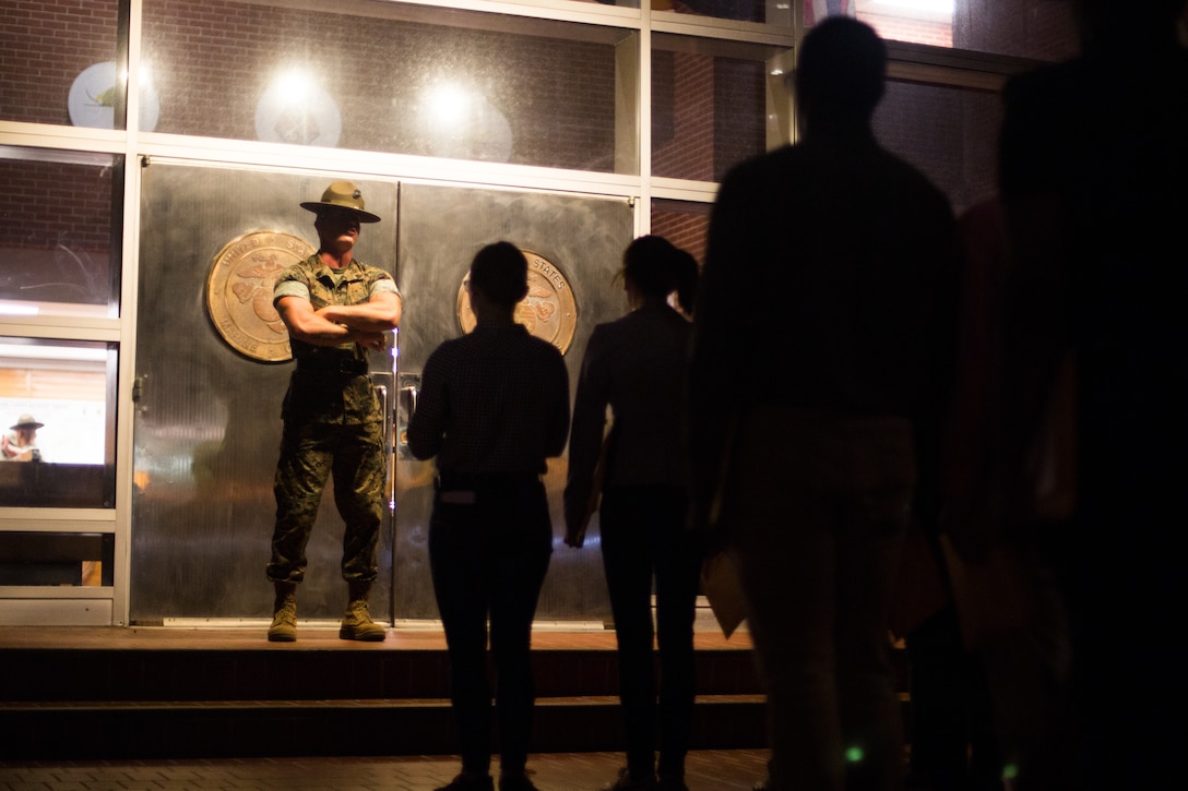 U.S. Marine Corps Staff Sgt. Richard Hibble, a senior drill instructor with Recruit Processing Company, Support Battalion, orders recruits of Bravo Company, 1st Recruit Training Battalion, and November Company, 4th Recruit Training Battalion, to walk through the iconic silver doors June 5, 2017, on Parris Island, S.C. Senior drill instructors, like Hibble, 28, from Kenilworth, N.J., are responsible for the accountability and administrative processing of new recruits before they start training with their company drill instructors. Bravo Company is scheduled to graduate Sept. 1, 2017. Parris Island has been the site of Marine Corps recruit training since Nov. 1, 1915. Today, approximately 19,000 recruits come to Parris Island annually for the chance to become United States Marines by enduring 12 weeks of rigorous, transformative training. Parris Island is home to entry-level enlisted training for approximately 49 percent of male recruits and 100 percent of female recruits in the Marine Corps. (U.S. Marine Corps photo by Lance Cpl. Carlin Warren)