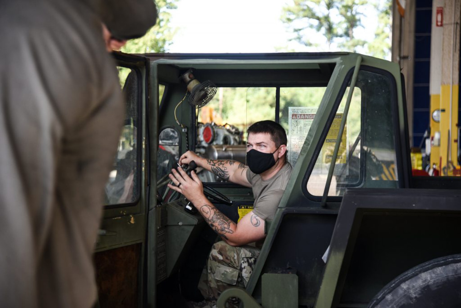 A Virginia National Guard Soldier assists Marines assigned to Marine Attack Squadron 223 as they install a new engine in an AV-8B Harrier jet Oct. 1, 2020, at the Virginia National Guard’s Army Aviation Support Facility in Sandston, Virginia.