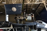 Marines assigned to Marine Attack Squadron 223, Cherry Point, North Carolina, install a new engine in an AV-8B Harrier jet Oct. 1, 2020, at the Virginia National Guard’s Army Aviation Support Facility in Sandston, Virginia.