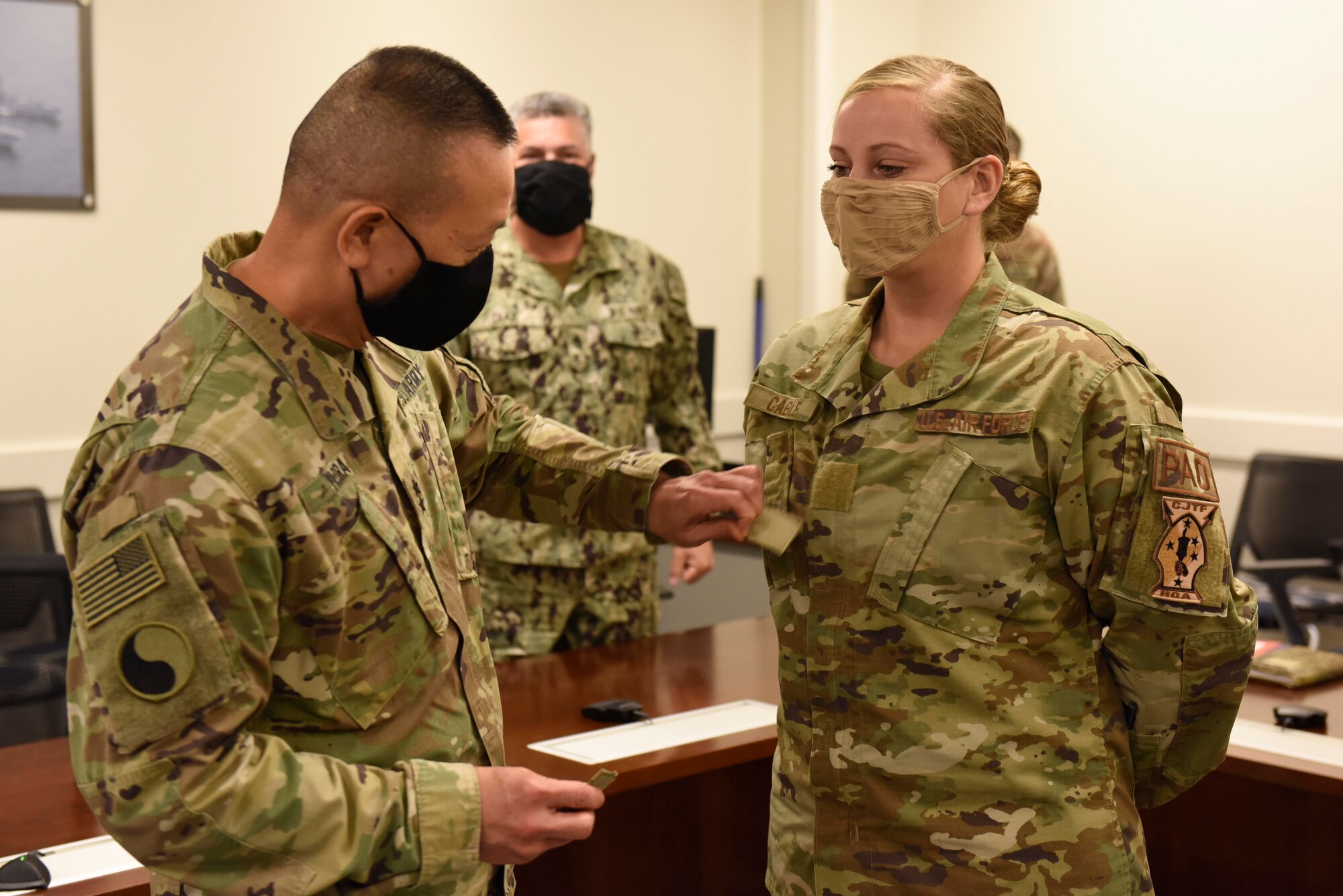 U.S. Army Maj. Gen. changes out rank for  U.S. Air Force Tech. Sgt.