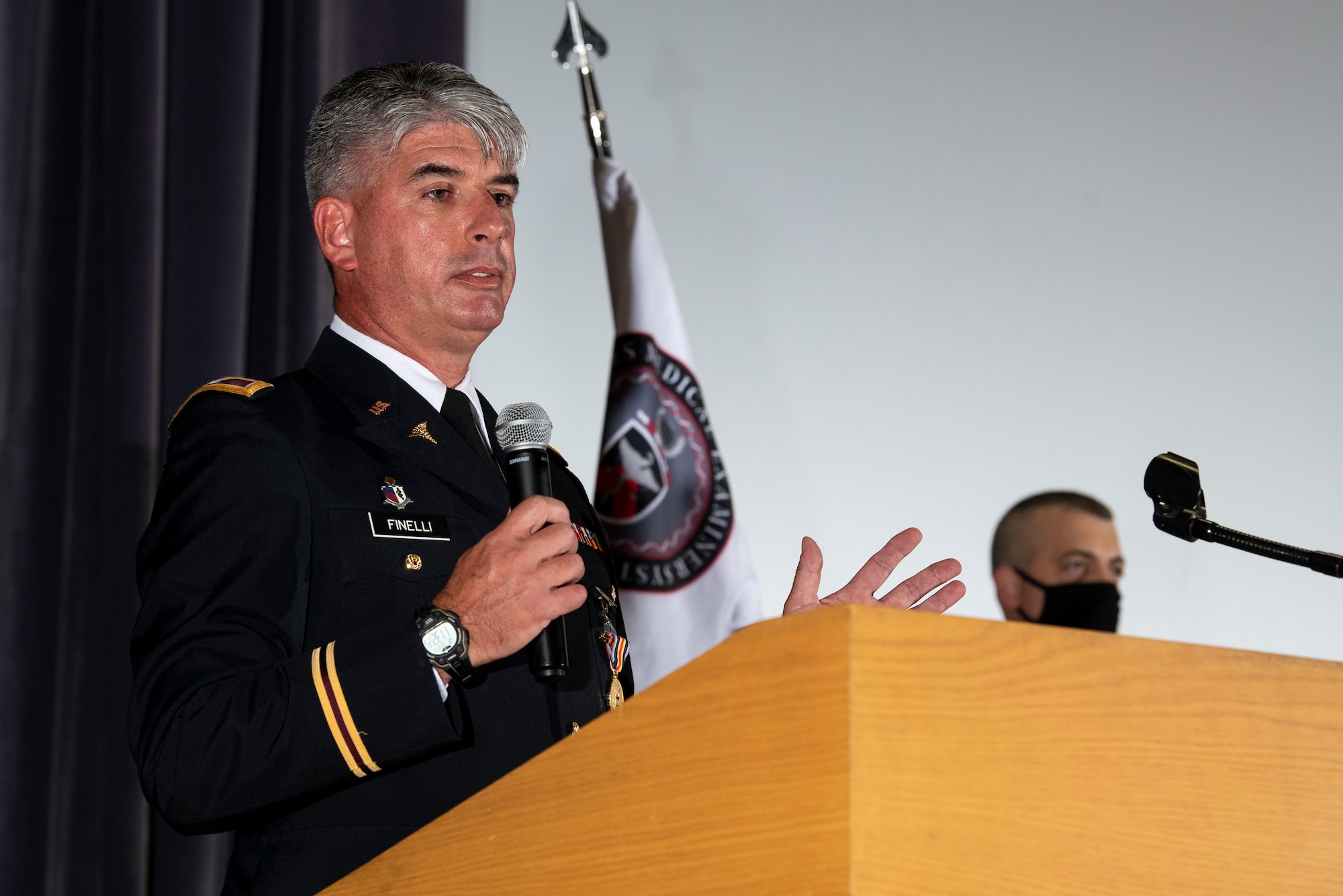 U.S. Army Col. Louis Finelli, outgoing Armed Forces Medical Examiner System  director, gives a speech during a change of directorship ceremony at Dover Air Force Base, Delaware, Oct. 21, 2020. AFMES is committed to being the Department of Defense’s leader in providing medical-legal services and emerging technologies essential for the readiness, sustainability and survivability of U.S. service members. (U.S. Air Force photo by Senior Airman Christopher Quail)