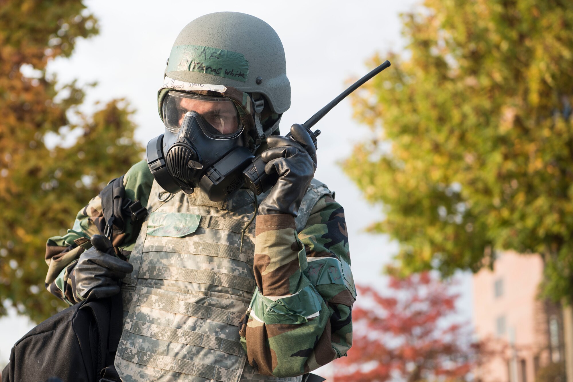 U.S. Air Force Senior Airman Thomas White, 721st Aerial Port Squadron passenger service agent, talks on a hand-held radio during exercise Nodal Lightning 20-2