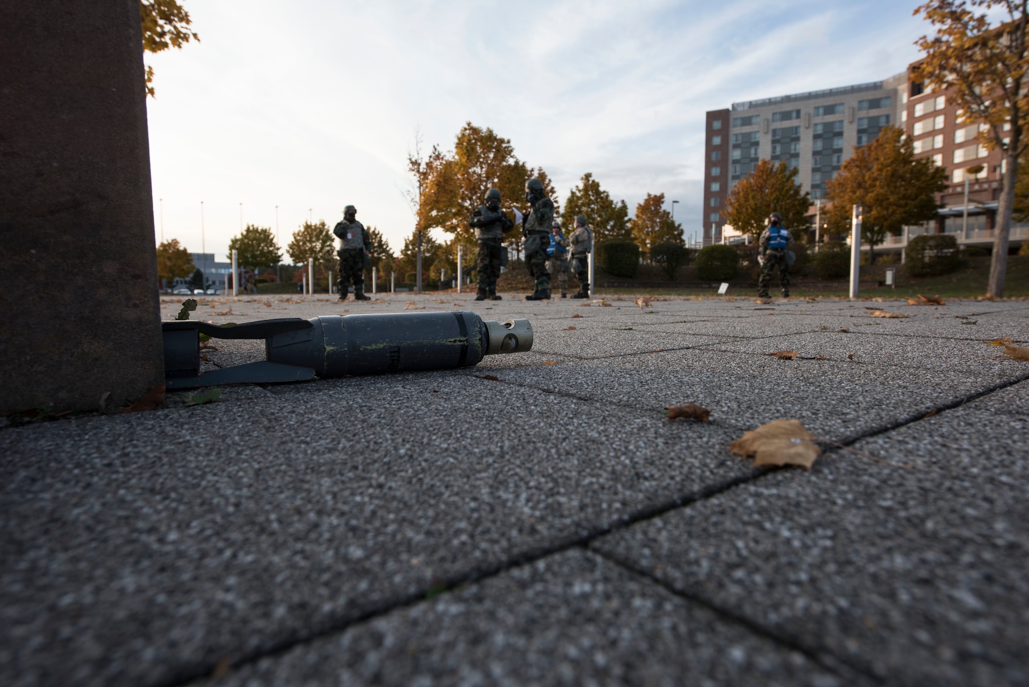 A simulated unexploded ordnance sits on the ground after being identified by Airmen assigned to the 721st Aerial Port Squadron during a post-attack reconnaissance sweep