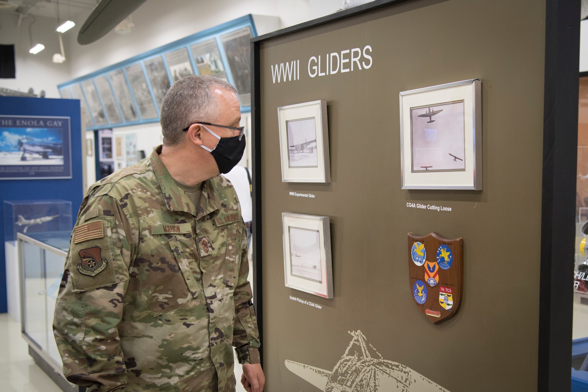 Chief Master Sgt. Wesley Marion, 434th Air Refueling Wing command chief, views a display of the World War II gliders used by the 434th Troop Carrier Group, the legacy unit to the 434th ARW at the Atterbury-Bakalar Air Museum in Columbus, Indiana, Sept. 17, 2020.  The primary mission of troop carrier units was to provide transportation for parachute troops, airborne infantry, and glider units. (U.S. Air Force photo/Master Sgt. Ben Mota)