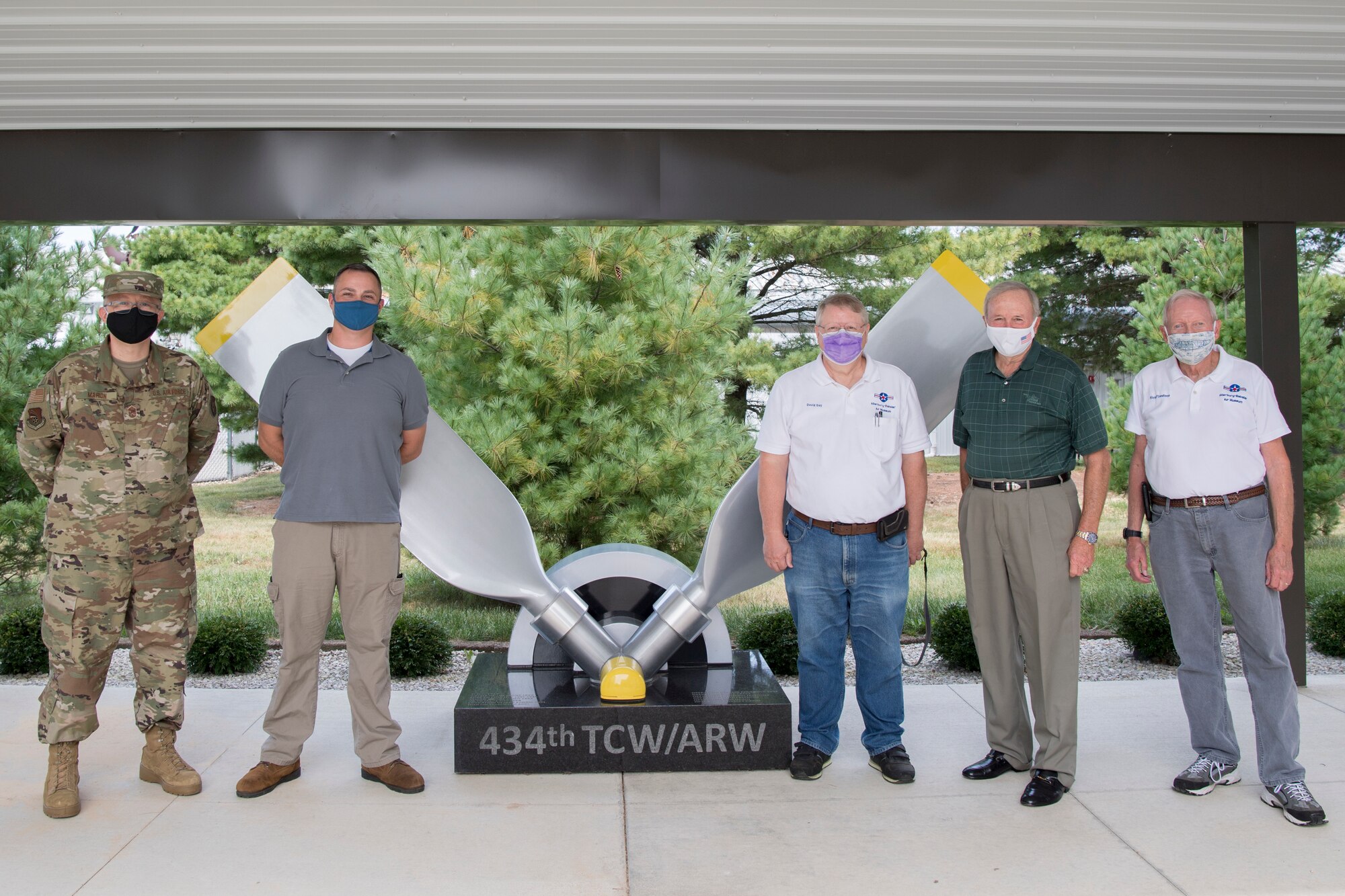 From the left, Chief Master Sgt. Wesley Marion, 434th Air Refueling Wing command chief, Brian Knowles, 434th ARW historian, pose for a photo with Atterbury-Bakalar Air Museum employees David Day, retired Air Force Maj. Gen. Mark Pillar, and Nick Firestone in front of the 434th monument at the museum in Columbus, Indiana, Sept. 17, 2020. Grissom personnel received a private tour of the facilities to learn more about the history and heritage of the 434th ARW. (U.S. Air Force photo/Master Sgt. Ben Mota)