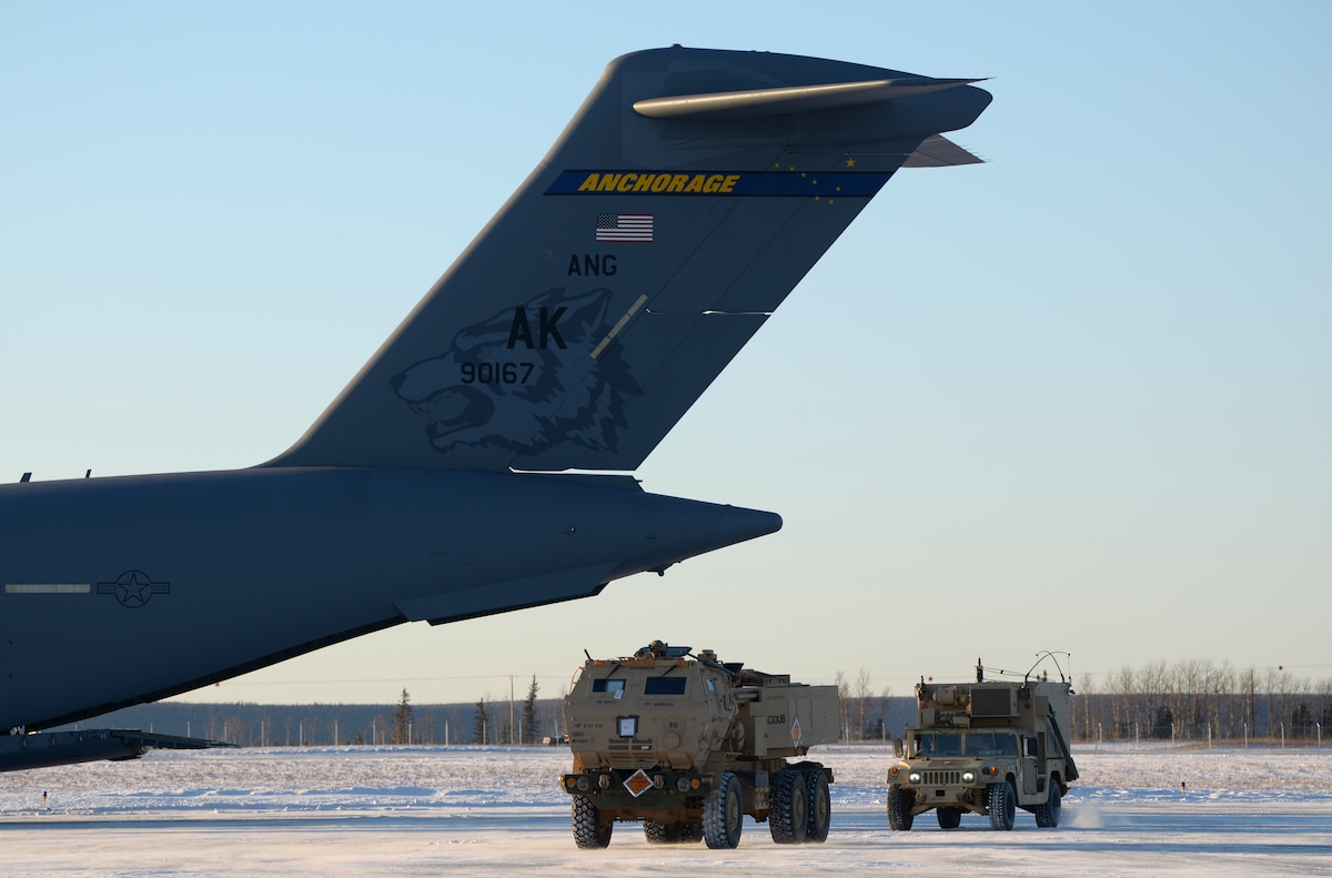 A U.S. Army M142 High Mobility Artillery Rocket System is unloaded from a C-17 Globemaster at Fort Greely, Alaska, Oct. 22, 2020. This iteration of RF-A focused mainly on joint integration of U.S. military branches.(U.S. Air Force photo by Senior Airman Beaux Hebert)