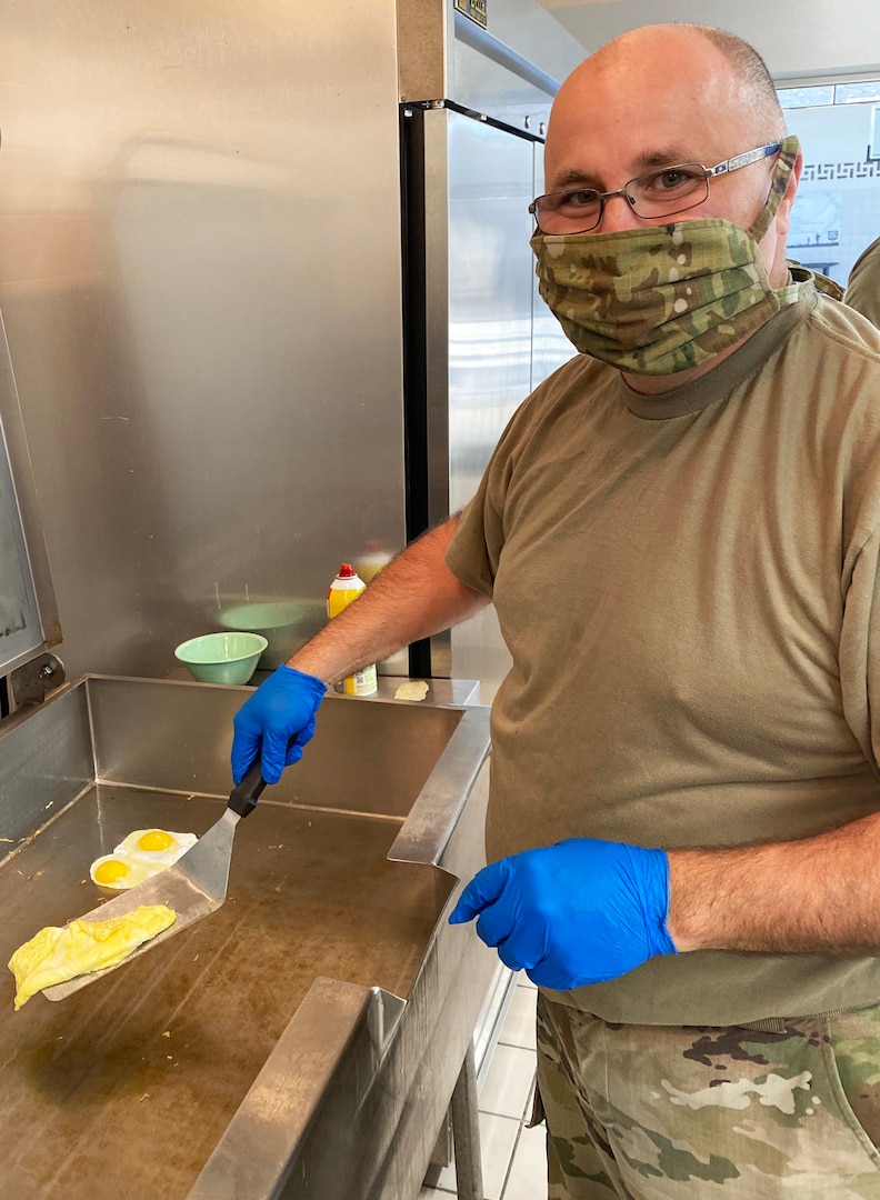 Capt. David Schlador scrambles an egg at the weekly pancake breakfast hosted at Joint Force Headquarters, Madison, Wis., Oct. 2, 2020. Schlador implemented the breakfast after seeing its success in other units. He said the eggs-to-order part was his idea and that it quickly became more popular than the pancakes.