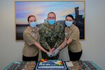 PORTSMOUTH, Va. (Oct. 21, 2020) – Capt. Todd Lewis, and two ceremony participants cut the cake for the National Disability Employment Awareness Month ceremony, Oct. 21.