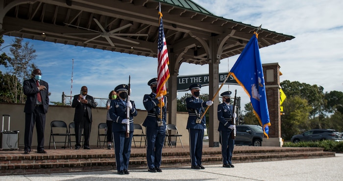 The Joint Base Charleston Honor Guard presents the colors during a recognition ceremony, Oct. 23, in Summerville, S.C. Members of both Joint Base Charleston and the community came together to honor the volunteer efforts of these Airmen who have been instrumental in the massive food giveaways orchestrated by the Summerville YMCA and the Community Resource Center Summerville where they helped provide over 60,000 boxes of groceries and 2,400 kits of school supplies to Dorchester County Residents since the beginning of the pandemic.  (Photo by Staff Sgt. Tenley Long)