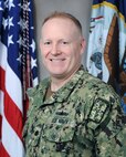 Official portrait of Cmdr. Steven Schmidt.