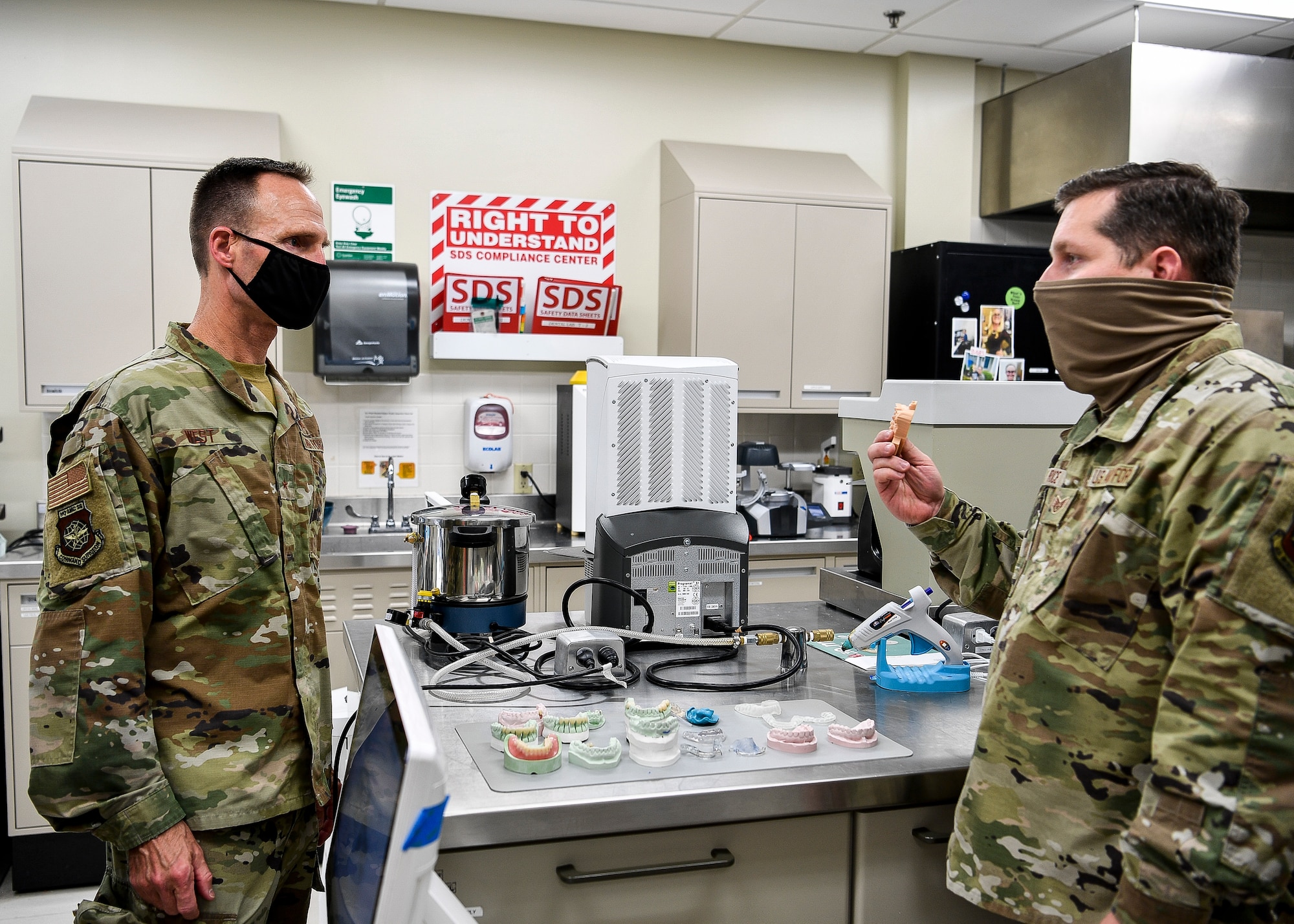 An Airman talks to another service member.