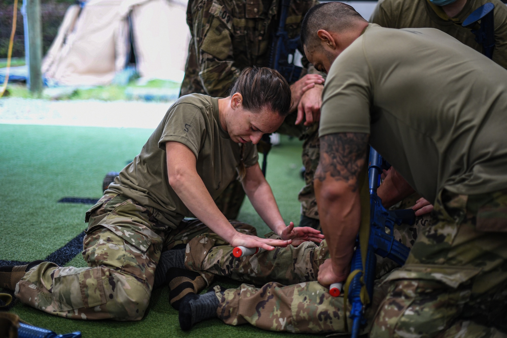 Special Operations Surgical Team candidates participate in a medical scenario performing emergency medical procedures