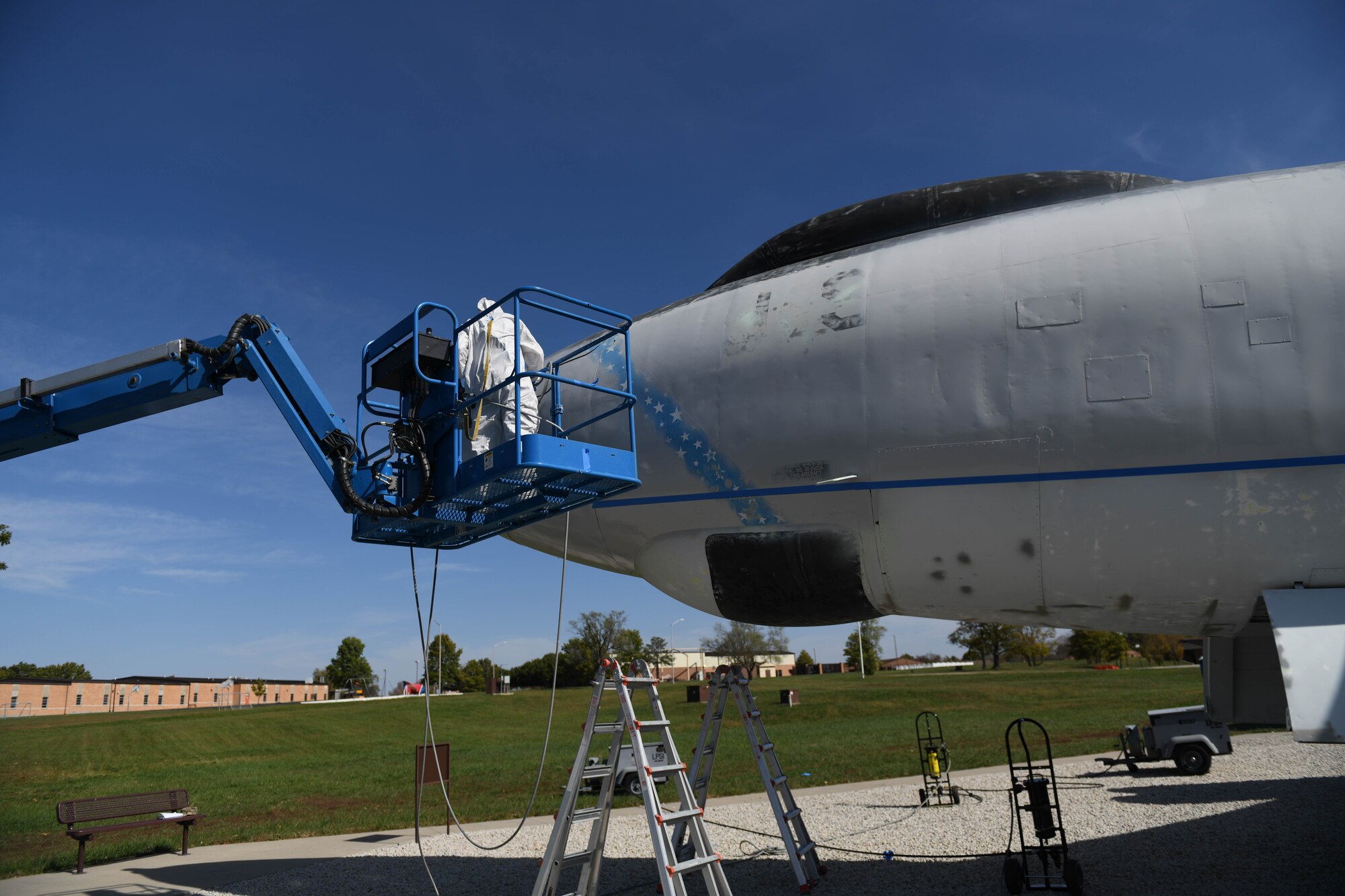 U.S. Air Force Tech. Sgt. Donald Curran, 509th Maintenance Squadron low-observable maintenance technician, uses a lift to check the front of the Boeing B-47 Stratojet static display at Whiteman Air Forces Base, Missouri on Oct. 14, 2020. Mobile lifts were required to reach many areas of the aircraft during its renovation. (U.S. Air Force photograph by Airman 1st Class Devan Halstead)