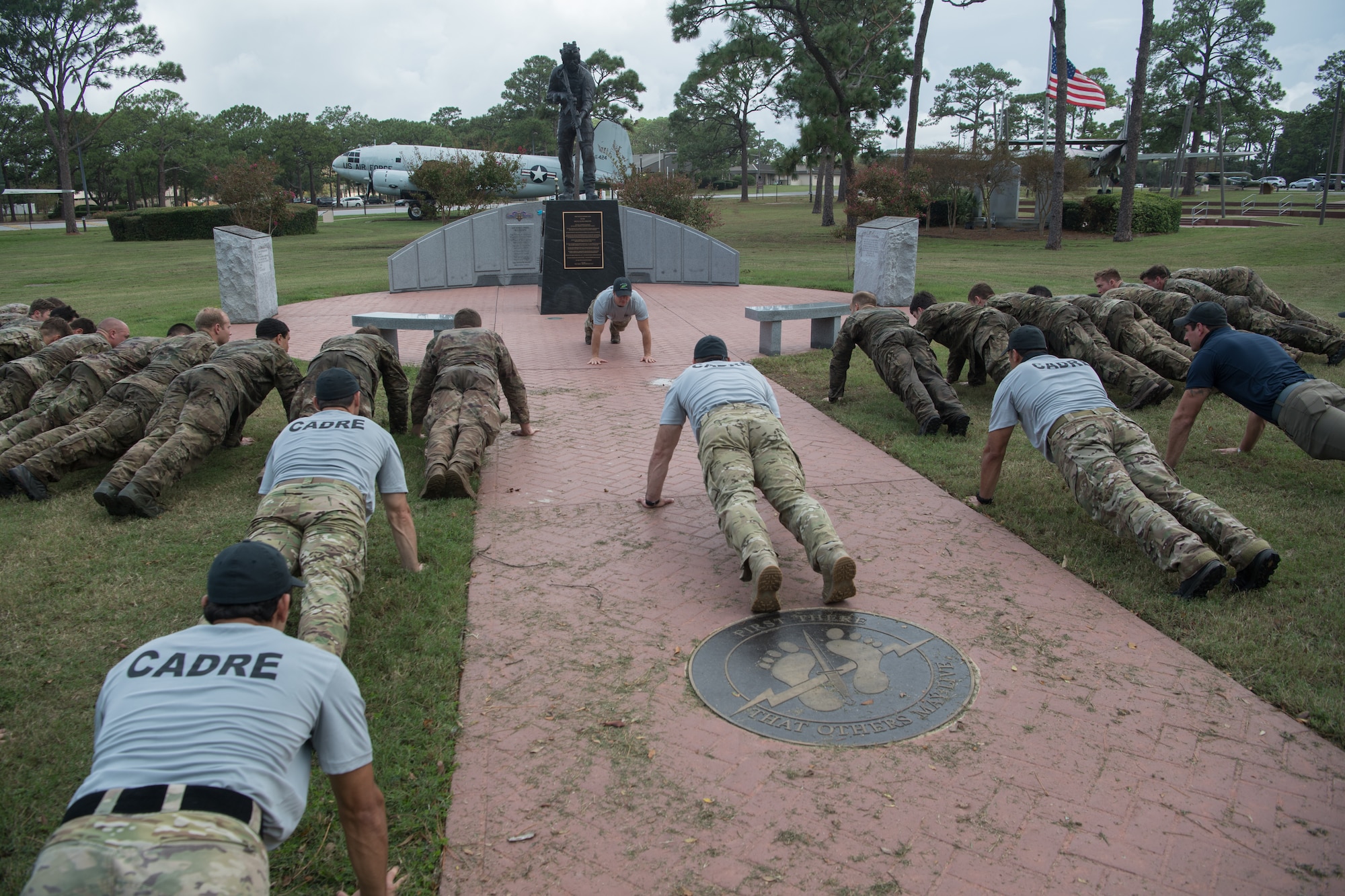 Special Tactics tactical air control party candidates and cadre participate in memorial pushups to honor and remember all the ST operators who came before them.