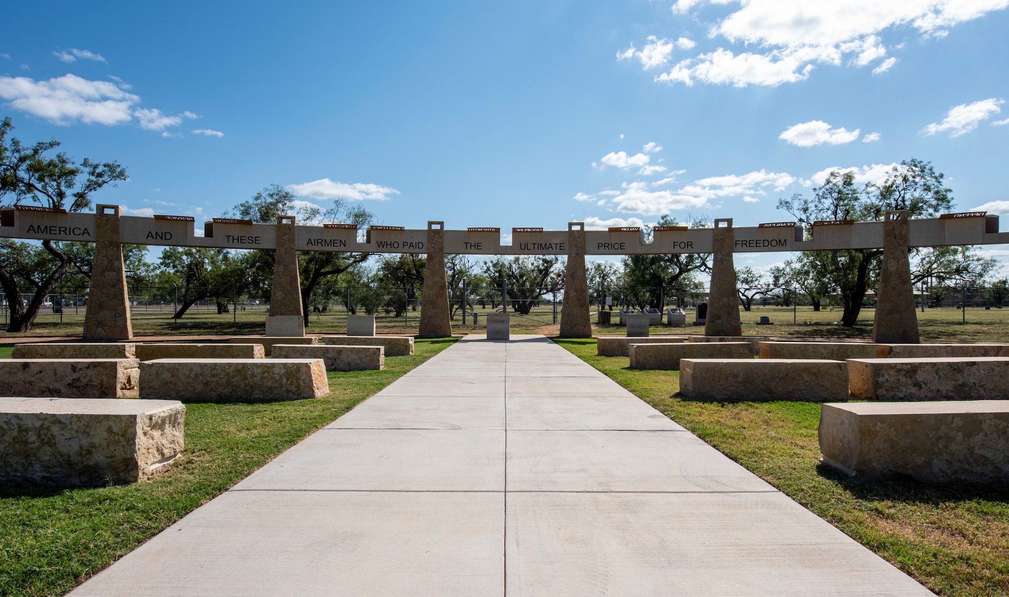 Photo depicts the Dyess Memorial Park from the front, midday.