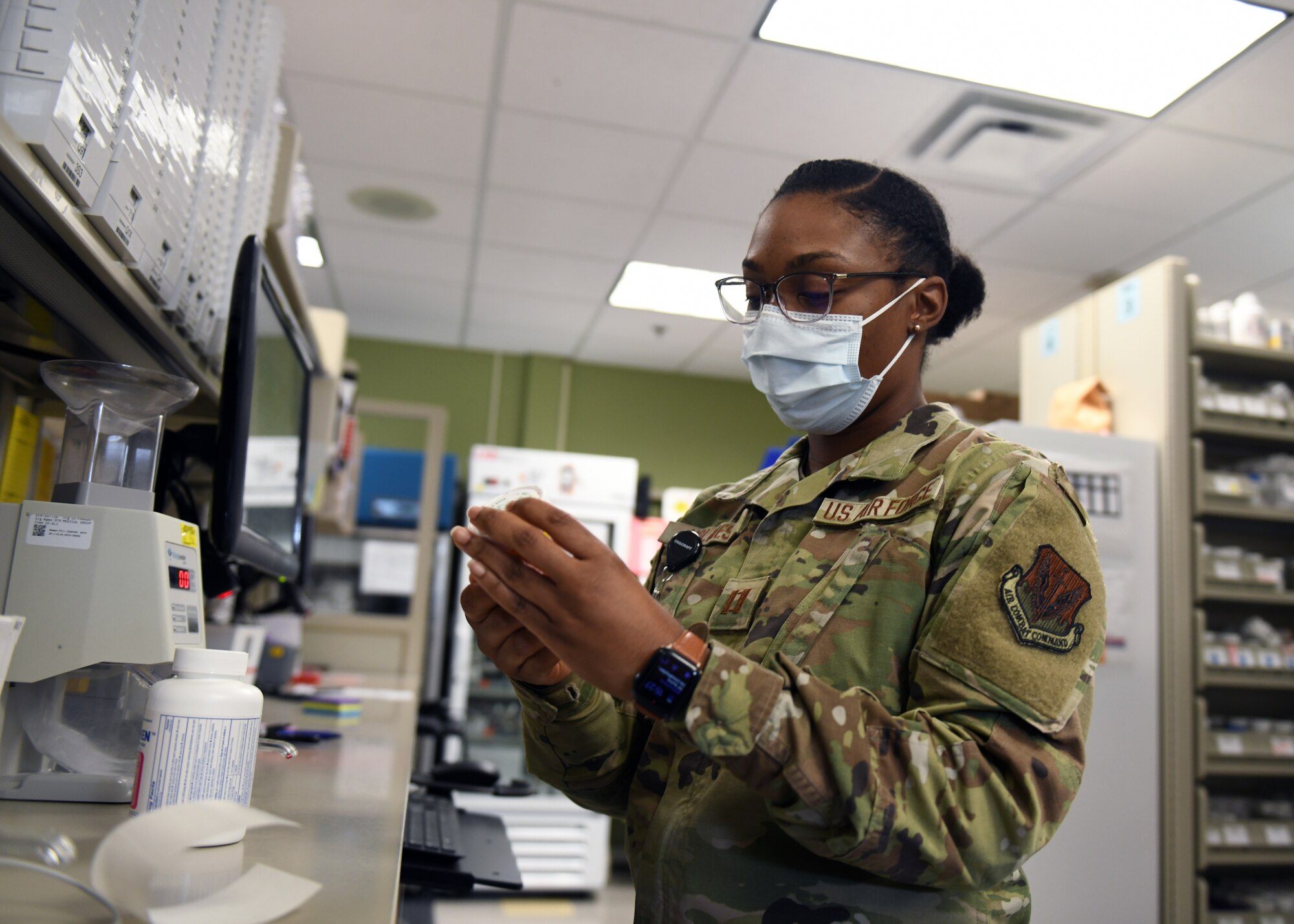 Capt. Brianna Holmes, 9th Healthcare Operations Squadron pharmacy element chief, labels a prescription pill vial, Oct. 22, 2020, at Beale Air Force Base, California. More than 10,000 prescriptions are filled by Airmen working at the pharmacy every month. (U.S. Air Force photo by Airman 1st Class Luis A. Ruiz-Vazquez)