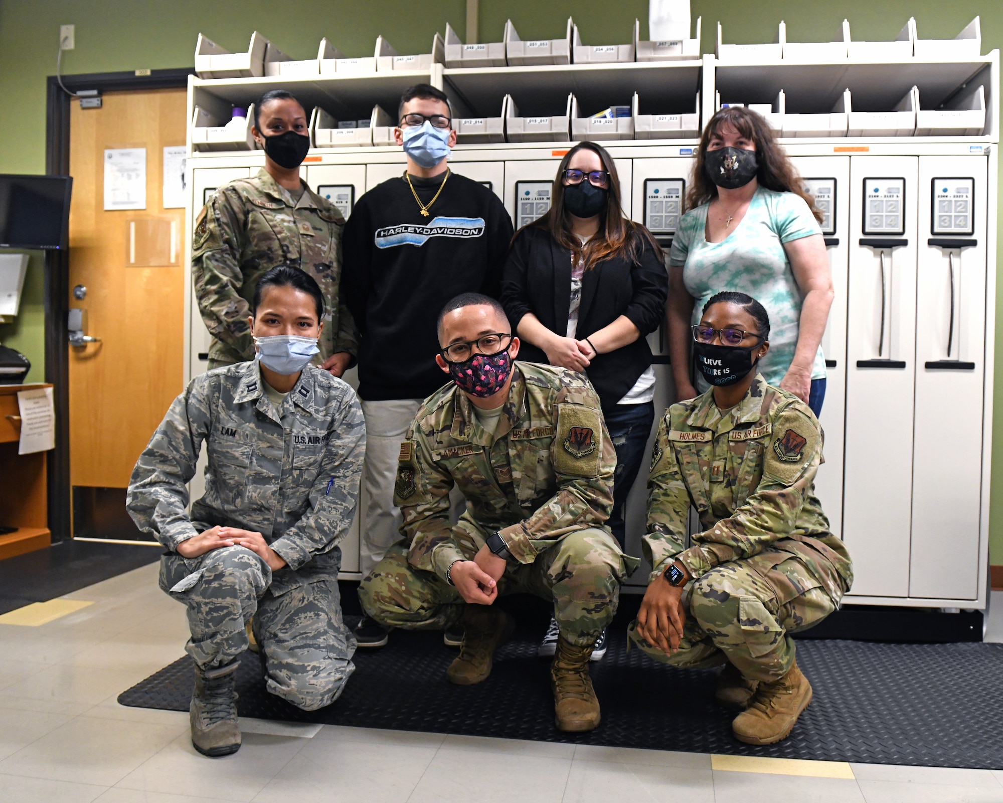 Members of the 9th Healthcare Operations Squadron pharmacy pose for a group photo, Oct. 23, 2020, at Beale Air Force Base, California. The Airmen and civilian contractors working at the pharmacy are an integral part of keeping Airmen and their families healthy. (U.S. Air Force photo by Airman 1st Class Luis A. Ruiz-Vazquez)