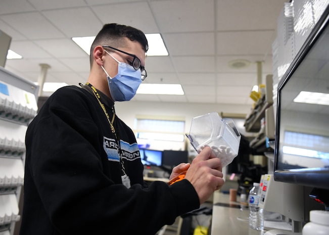 Paxton Ekkelboom, 9th Healthcare Operations Squadron certified pharmacy technician, fills a prescription pill vial, Oct. 23, 2020, at Beale Air Force Base, California. Airmen working at Beale’s pharmacy fill more than 10,000 prescriptions every month. (U.S. Air Force photo by Airman 1st Class Luis A. Ruiz-Vazquez)