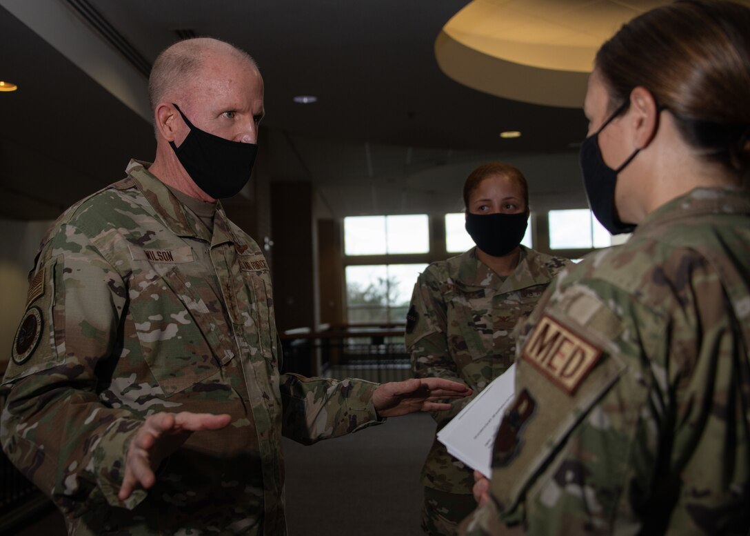 Vice Chief of Staff of the Air Force Gen. Stephen W. Wilson listens to a medical technician explain her efforts throughout the COVID-19 pandemic during a visit to the 42nd Medical Group, Oct. 22, 2020, Maxwell Air Force Base, Alabama. Wilson visited various offices within the 42 MDG to meet and personally
thank the medical personnel for their dedication to their service throughout the pandemic. (U.S. Air Force photo by Airman 1st Class Jackson Manske)